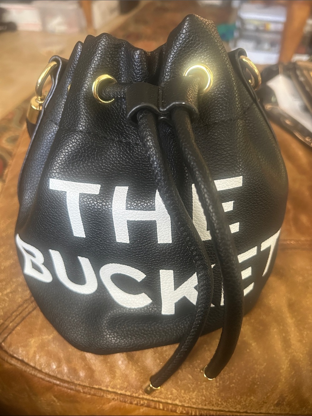 Black Drawstring Bucket Hobo Bag with White Lettering